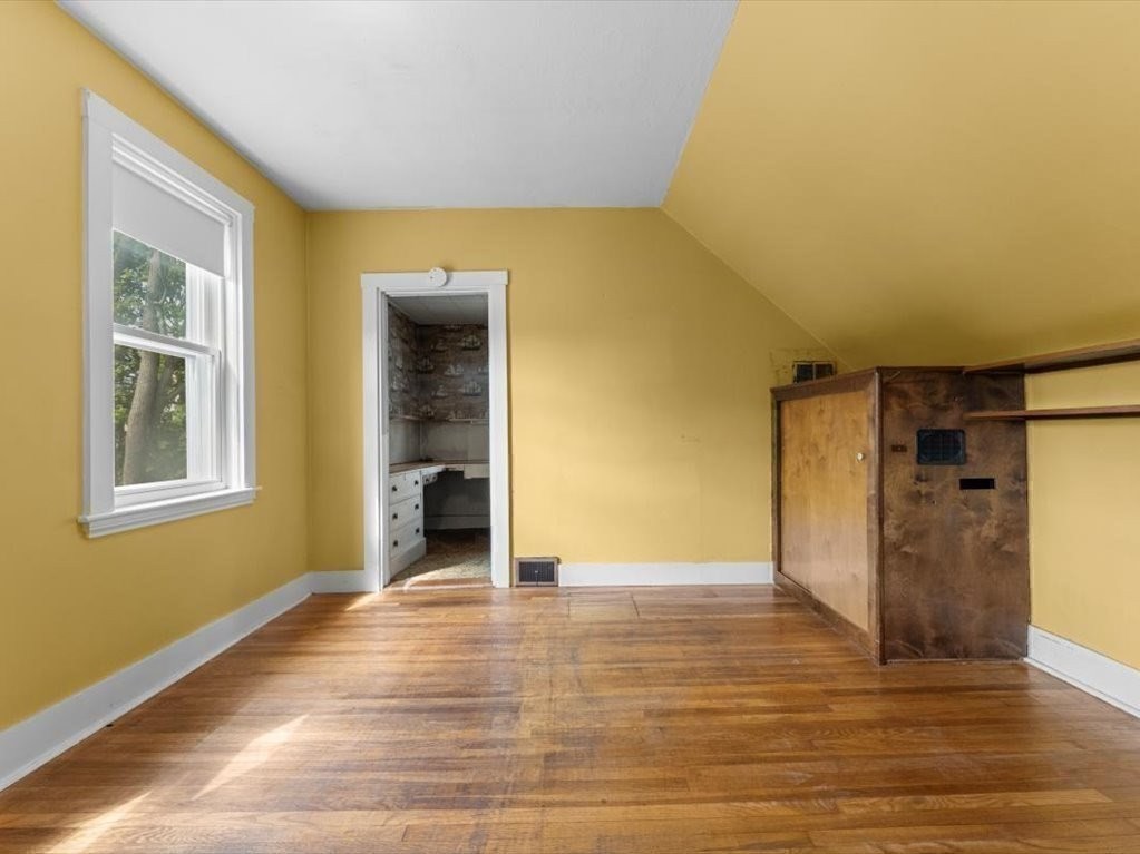 41 Sargent Street Winthrop, MA 02152 - Photo 30 of 40 a view of an empty room with wooden floor and a window