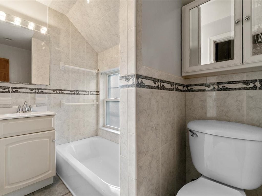 41 Sargent Street Winthrop, MA 02152 - Photo 32 of 40 a bathroom with a toilet a sink and bathtub