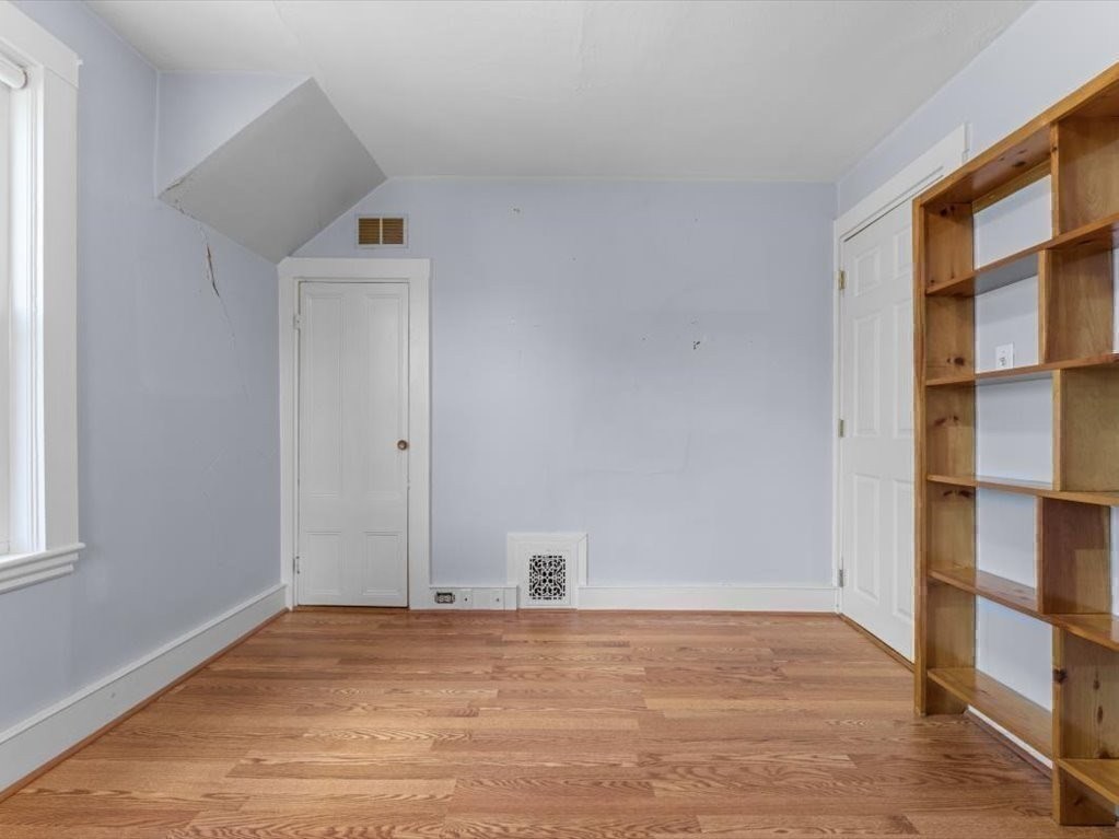 41 Sargent Street Winthrop, MA 02152 - Photo 35 of 40 a view of empty room with wooden floor and fan