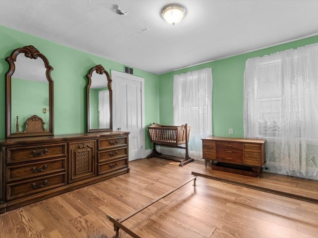41 Sargent Street Winthrop, MA 02152 - Photo 37 of 40 a spacious bedroom with a bed and a dresser