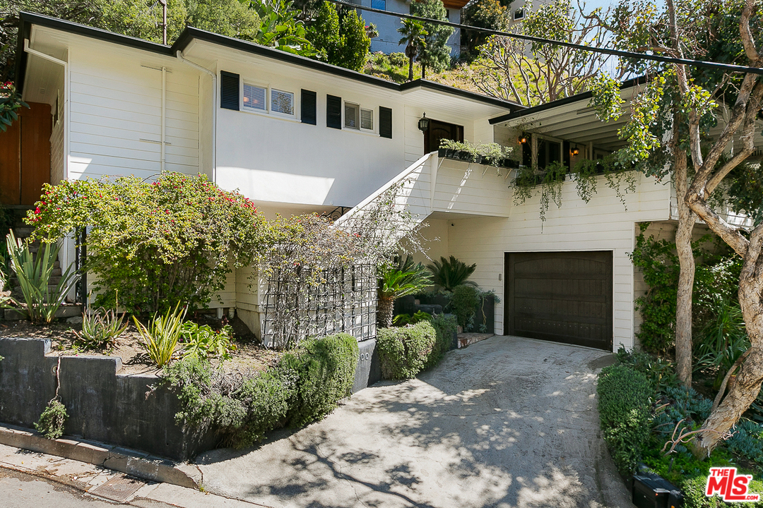 1600 Queens Road Los Angeles, CA 90069 - Photo 1 of 35 a view of a house with a yard and potted plants