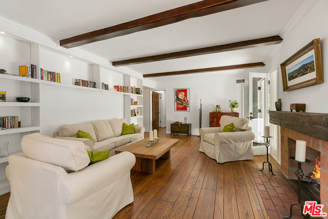 1600 Queens Road Los Angeles, CA 90069 - Photo 10 of 35 a living room with fireplace furniture and a wooden floor