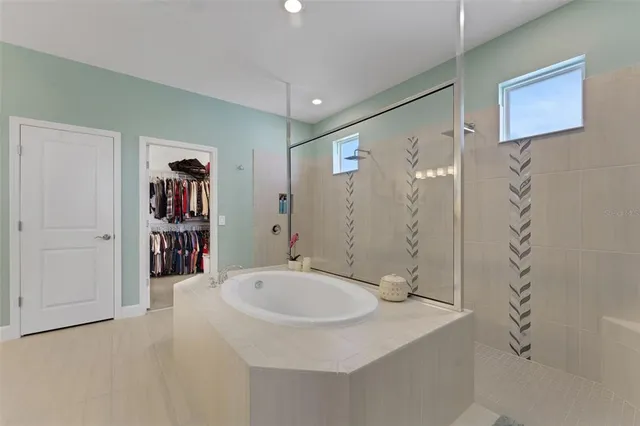 a bathroom with a sink a mirror and a shower