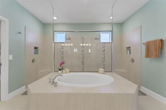 a bathroom with a double vanity sink a mirror a vanity and a shower