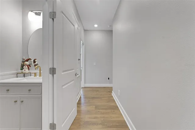 a bedroom with furniture and a large window