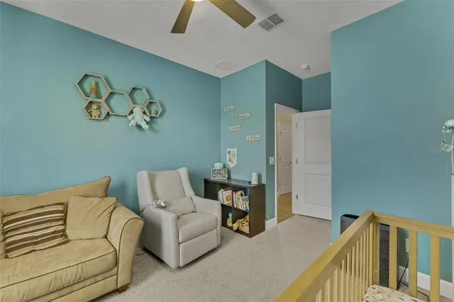 a bedroom with a bed a desk and chair