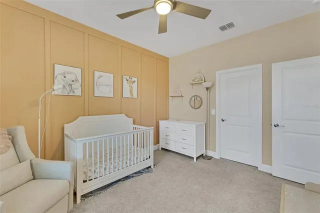 a bathroom with a sink a toilet and shower curtain