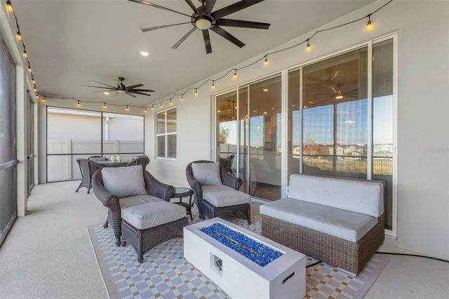 a view of a house with a yard and a large tree