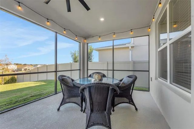 a view of a house with a yard and sitting area