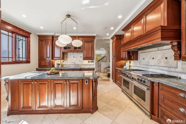 a kitchen with stainless steel appliances granite countertop a sink and dishwasher cabinets with wooden floor