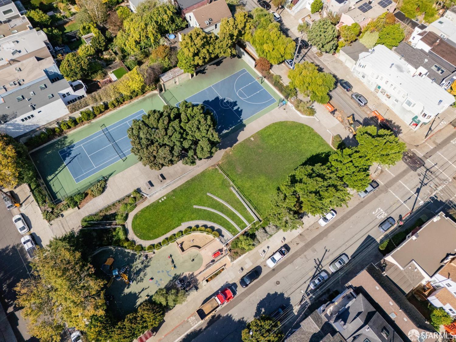 729 Douglass Street San Francisco, CA 94114 - Photo 5 of 79 an aerial view of a multi story residential apartment building with a yard