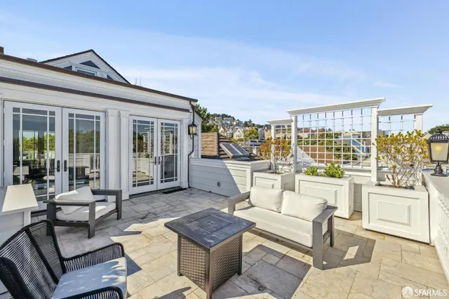 a view of balcony with furniture