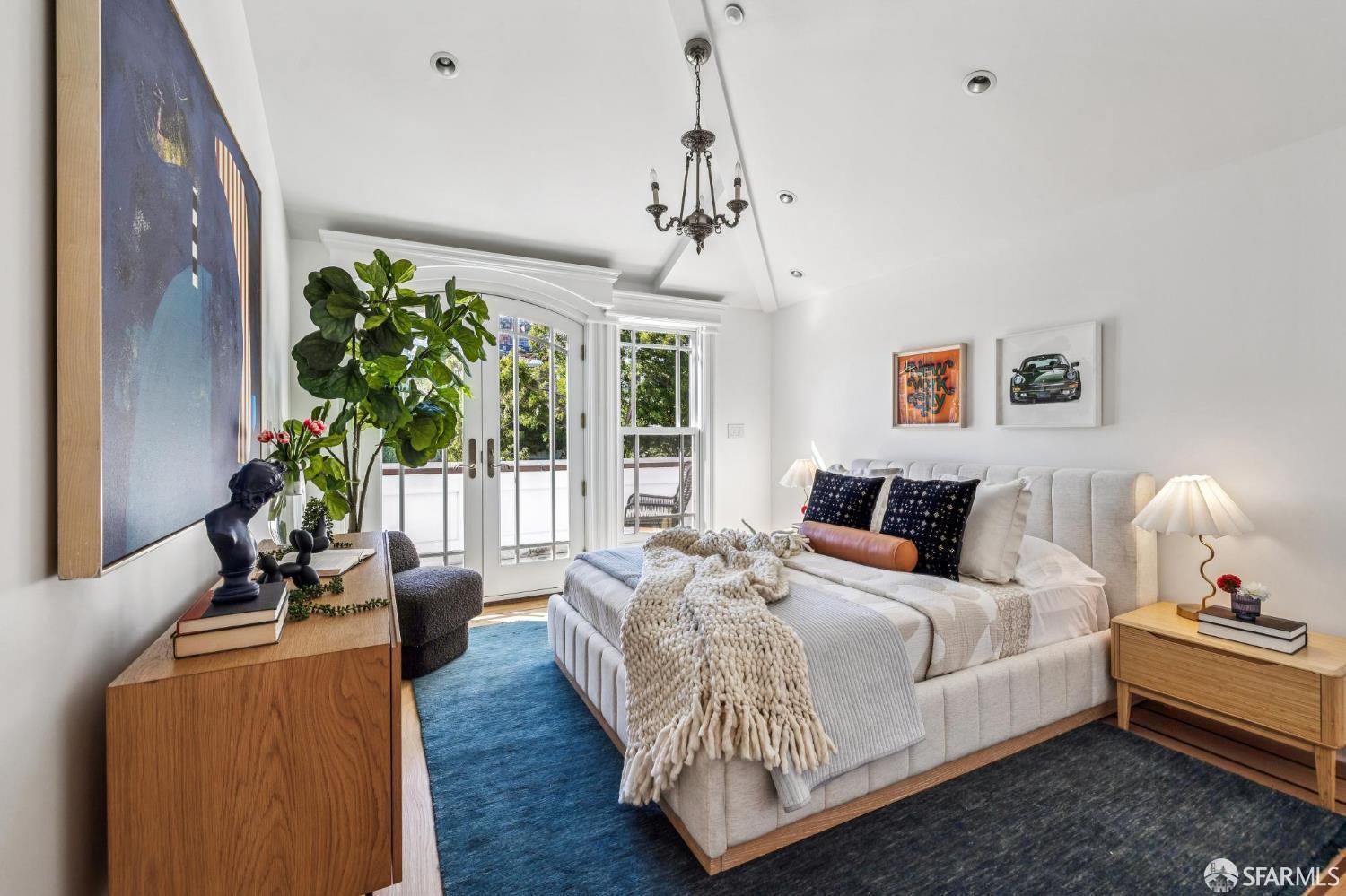 729 Douglass Street San Francisco, CA 94114 - Photo 56 of 79 a bedroom with bed or furniture and a chandelier