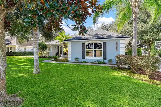 a front view of house with yard and green space