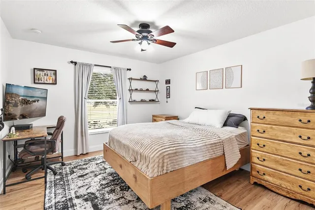 a bedroom with a bed and a window