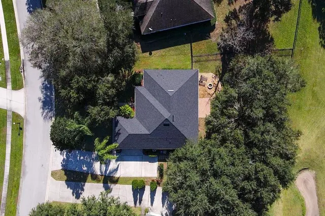 an aerial view of house with yard swimming pool and outdoor seating