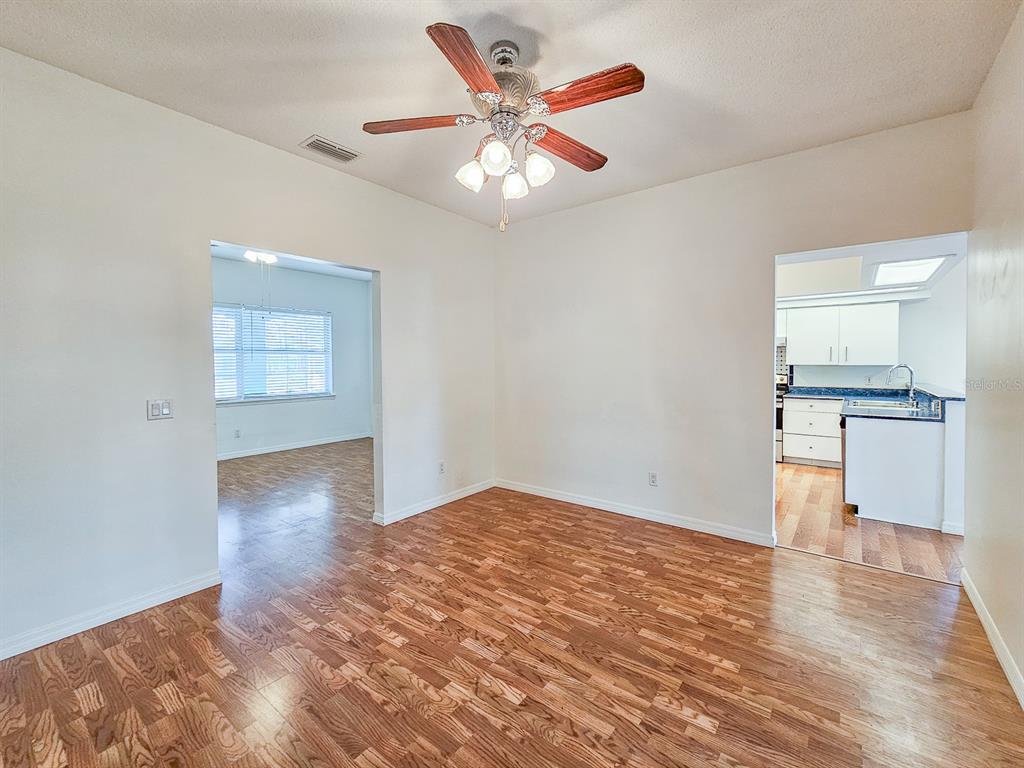 28 Botany Lane Palm Coast, FL 32137 - Photo 18 of 48 wooden floor in an empty room with a window