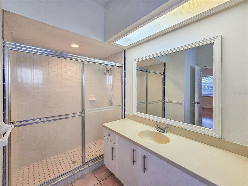 28 Botany Lane Palm Coast, FL 32137 - Photo 26 of 48 a bathroom with a sink and a mirror