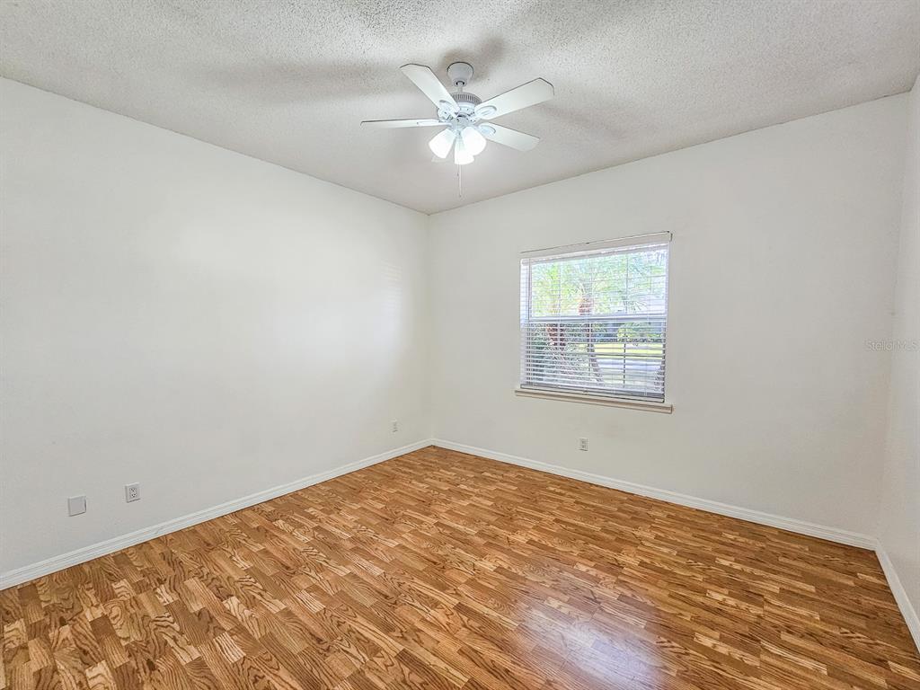 28 Botany Lane Palm Coast, FL 32137 - Photo 29 of 48 wooden floor in an empty room with a window