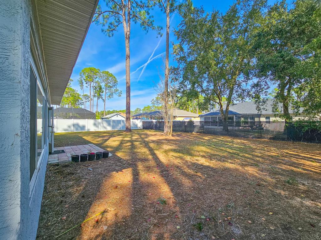 28 Botany Lane Palm Coast, FL 32137 - Photo 38 of 48 a view of a house with a yard
