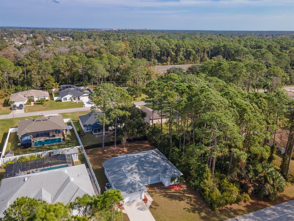 28 Botany Lane Palm Coast, FL 32137 - Photo 45 of 48 a view of a swimming pool with a yard