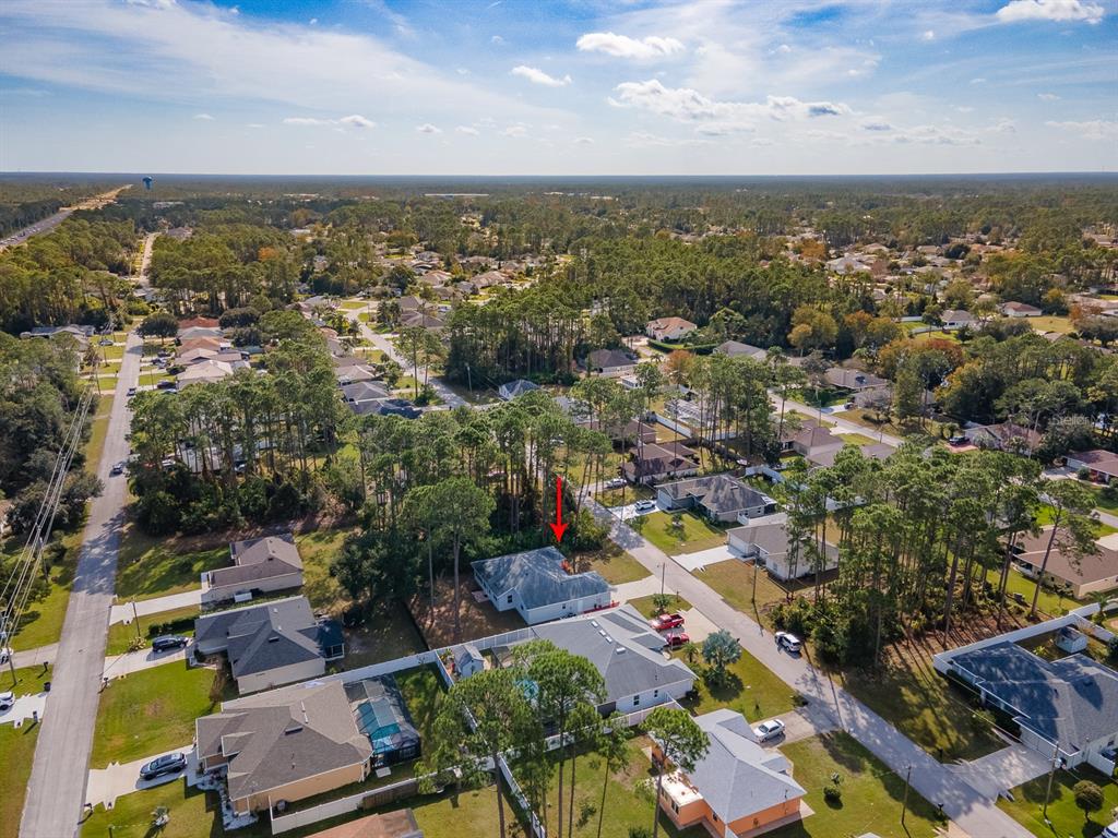 28 Botany Lane Palm Coast, FL 32137 - Photo 48 of 48 an aerial view of city and lake