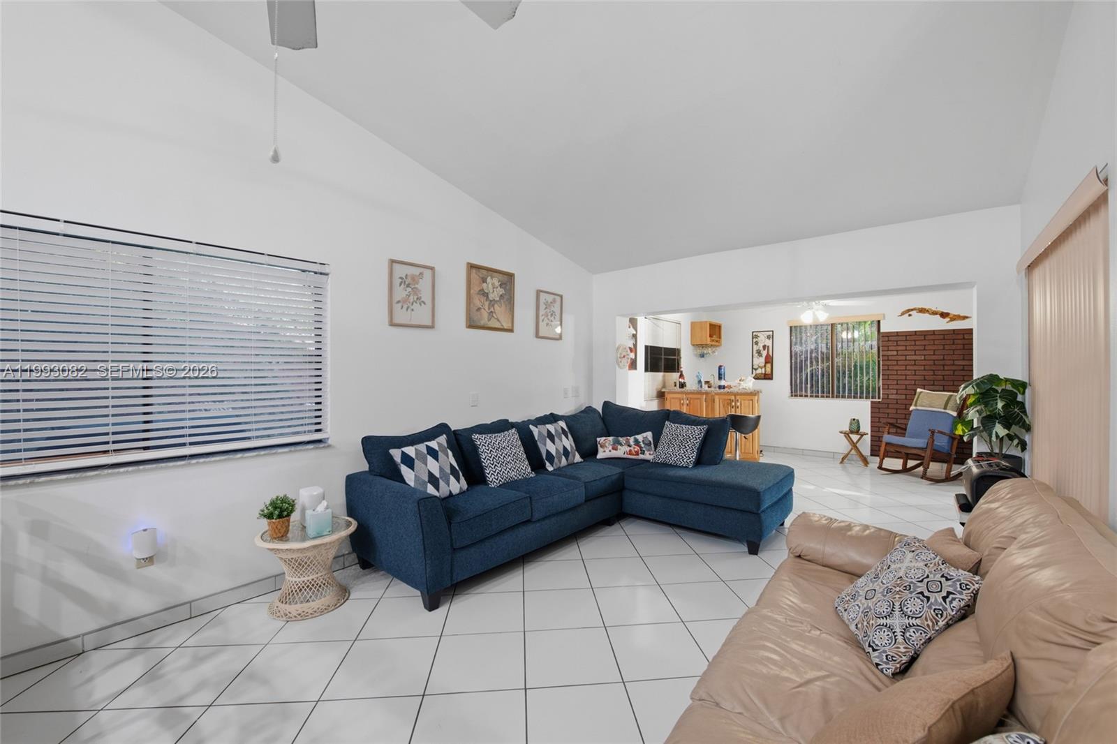 12702 Southwest 113th Lane Miami, FL 33186 - Photo 13 of 29 a living room with furniture and a window