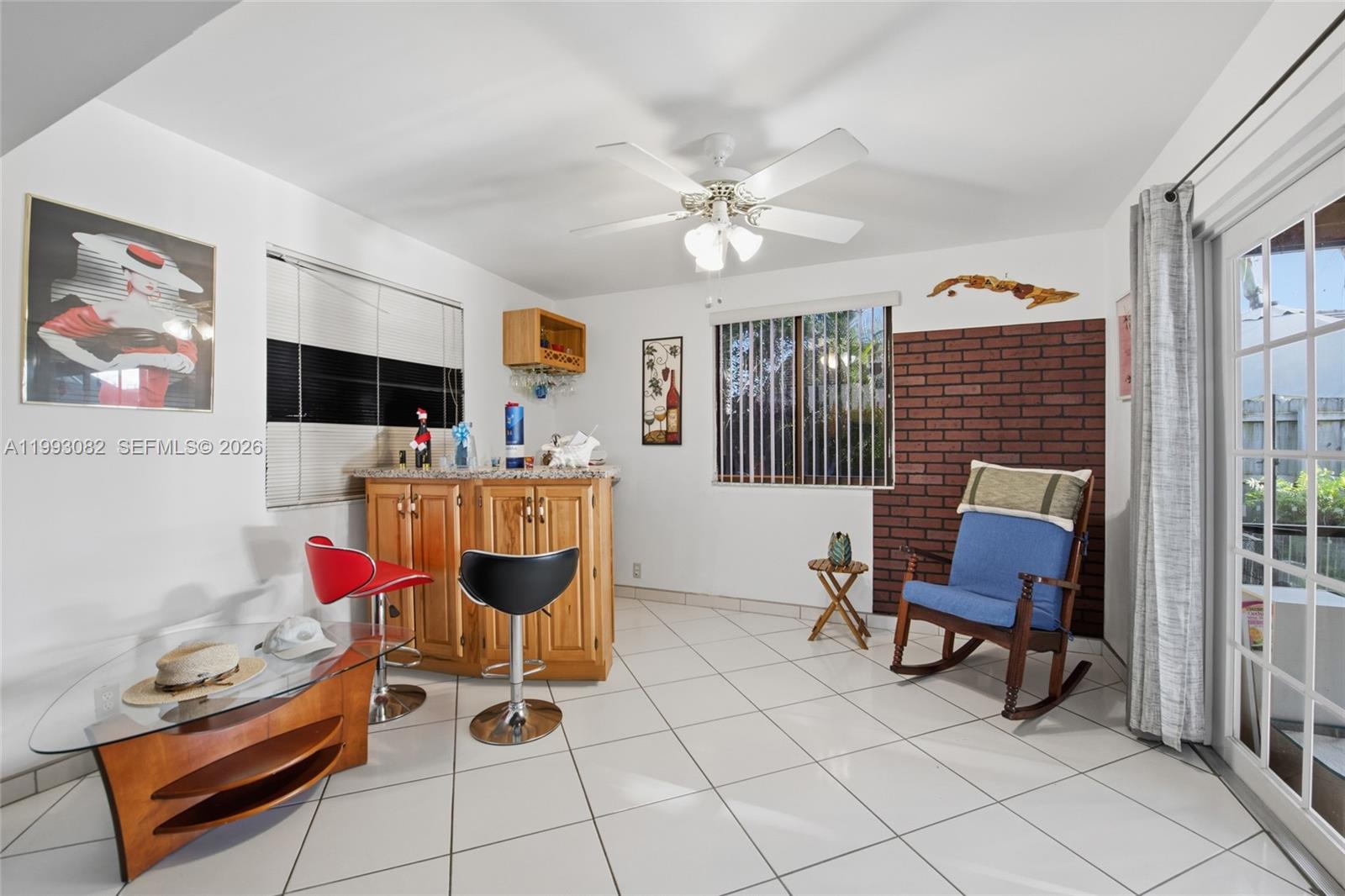 12702 Southwest 113th Lane Miami, FL 33186 - Photo 15 of 29 a living room with furniture and a flat screen tv