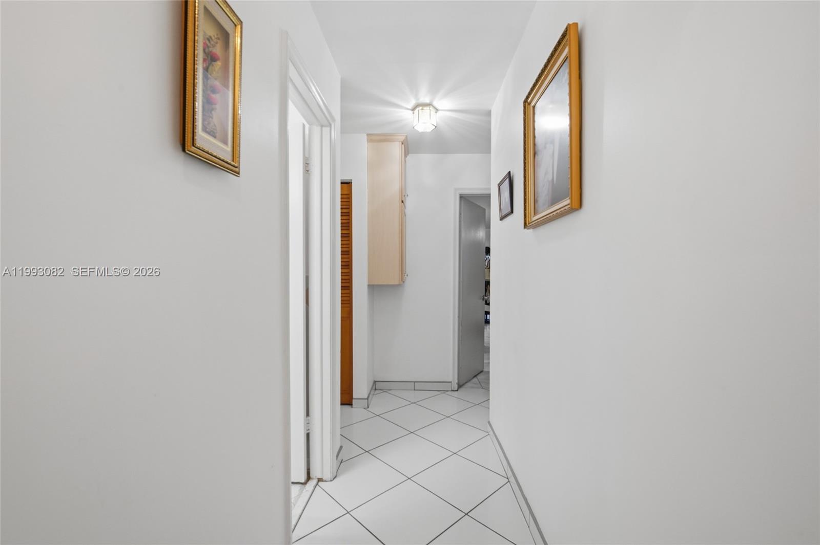 12702 Southwest 113th Lane Miami, FL 33186 - Photo 16 of 29 a view of a hallway with wooden floor