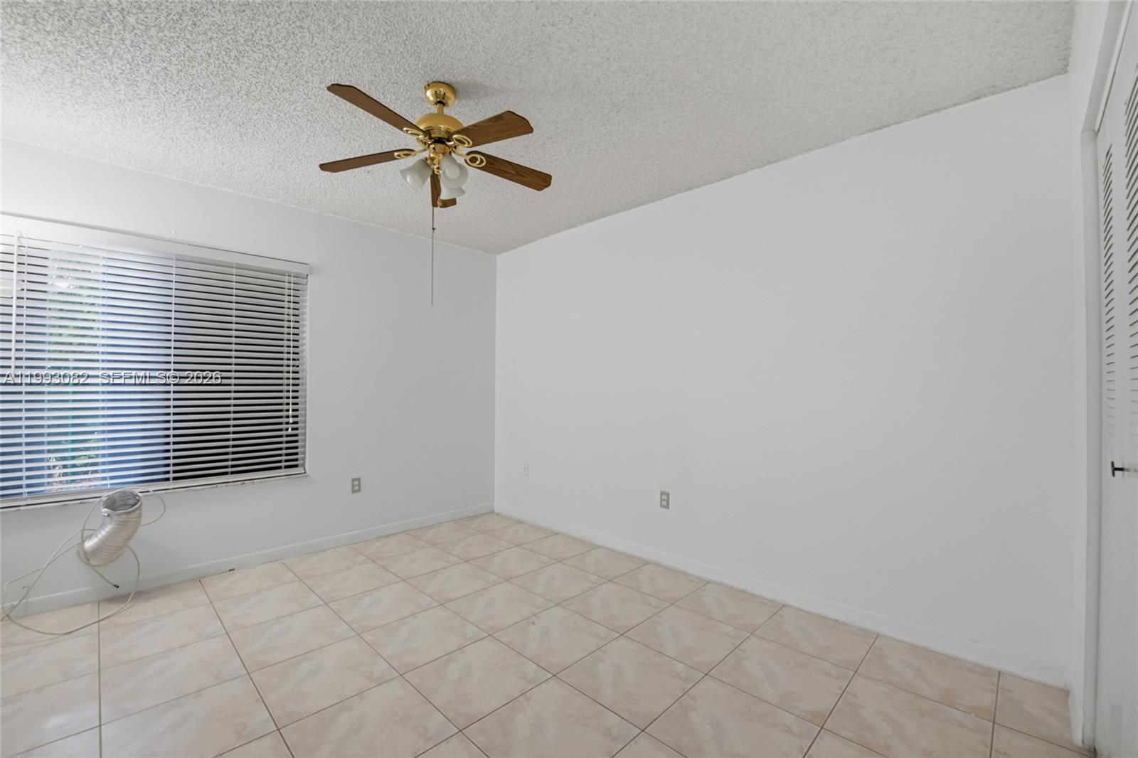 12702 Southwest 113th Lane Miami, FL 33186 - Photo 20 of 29 a view of an empty room with a window