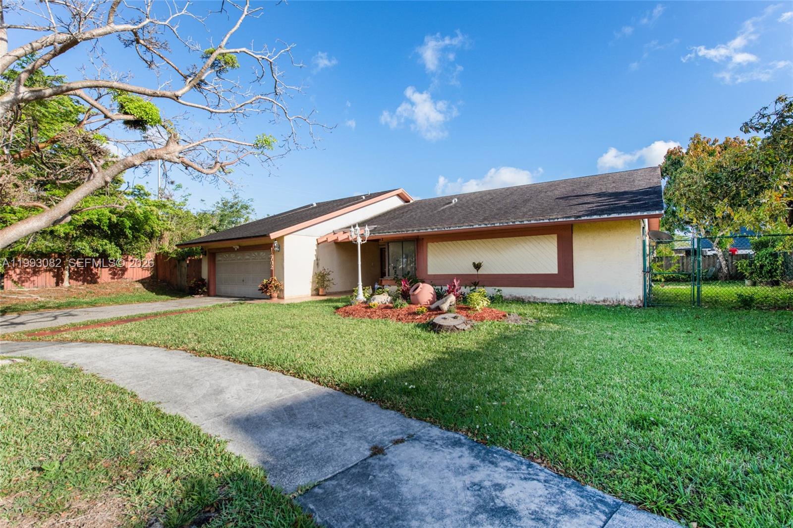 12702 Southwest 113th Lane Miami, FL 33186 - Photo 2 of 29 a view of a house with backyard and garden