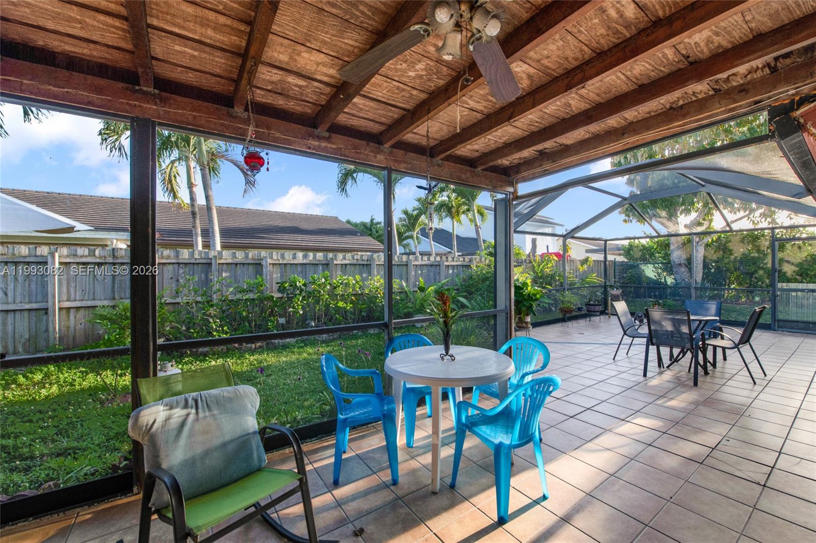 12702 Southwest 113th Lane Miami, FL 33186 - Photo 23 of 29 a patio with yard glass top table and chairs