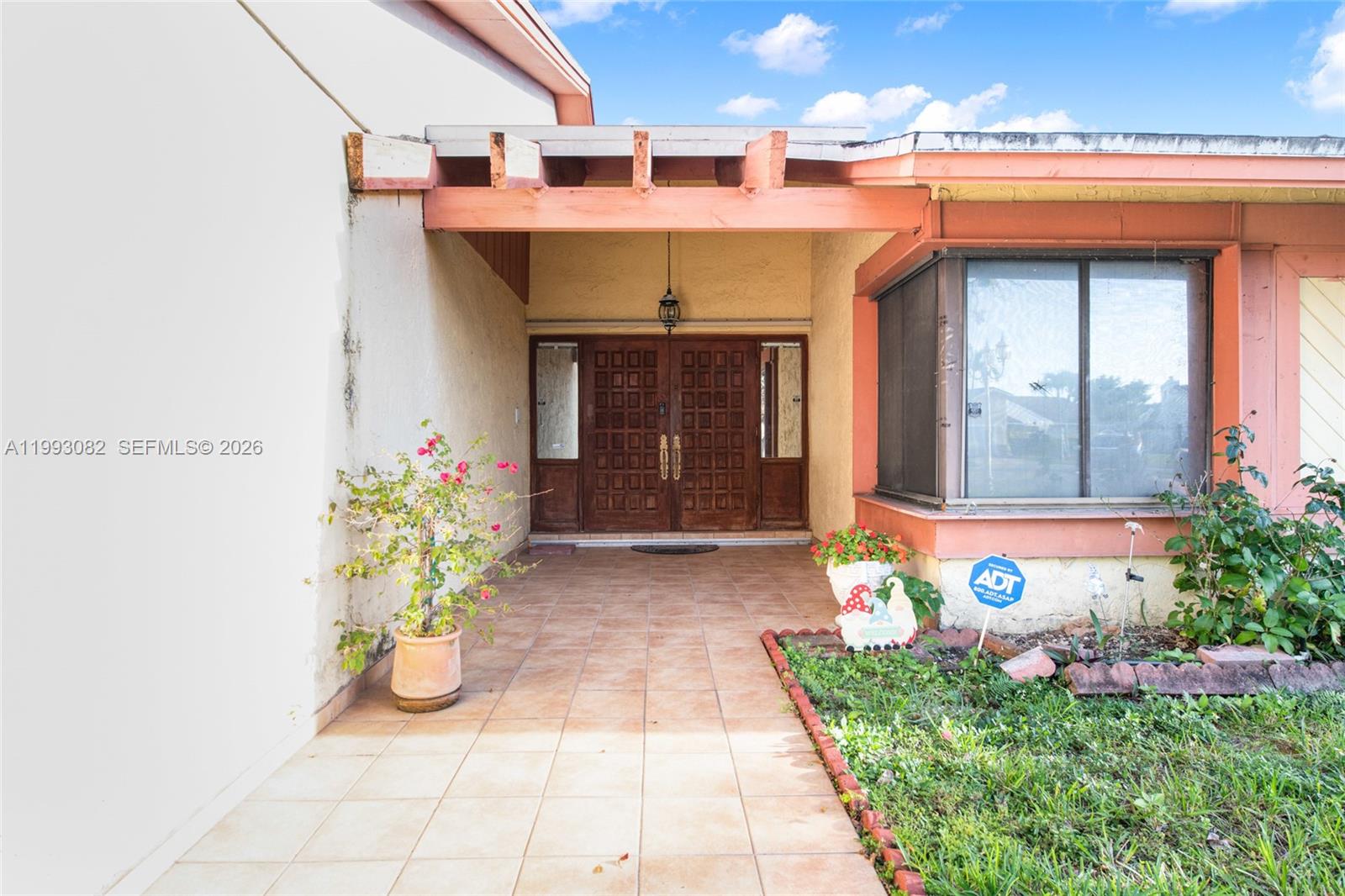 12702 Southwest 113th Lane Miami, FL 33186 - Photo 3 of 29 a front view of a house with plants