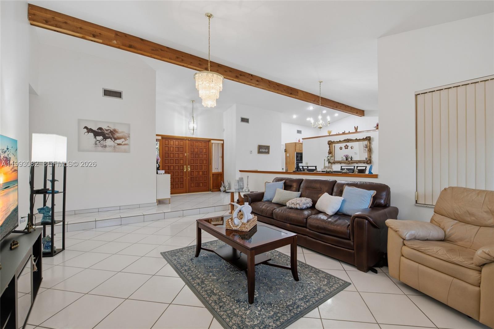 12702 Southwest 113th Lane Miami, FL 33186 - Photo 5 of 29 a living room with furniture and a flat screen tv