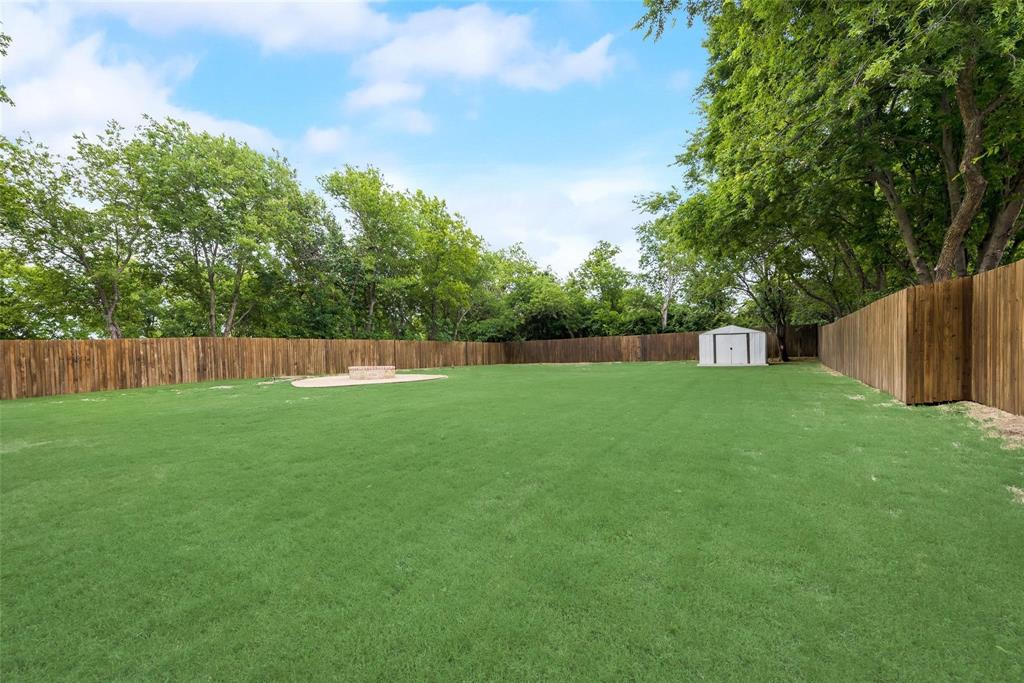 600 North 1st Street Midlothian, TX 76065 - Photo 20 of 21 a view of yard with trees in the background