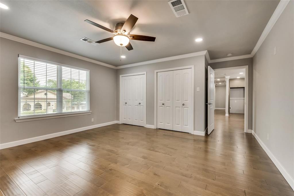 600 North 1st Street Midlothian, TX 76065 - Photo 9 of 21 a view of an empty room with wooden floor and a window