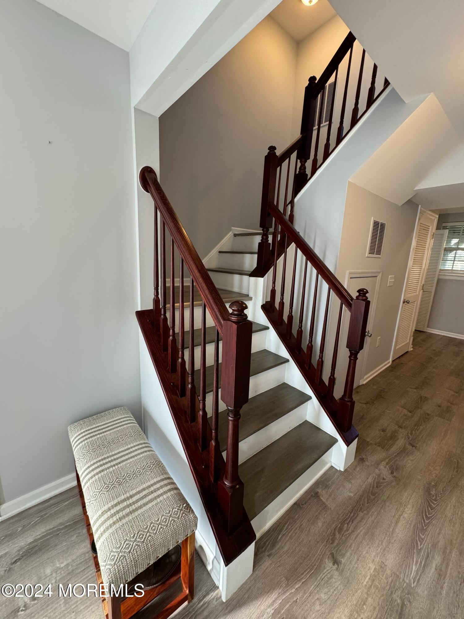 52 Saxton Road Farmingdale, NJ 07727 - Photo 14 of 52 a view of staircase with wooden floor and white walls