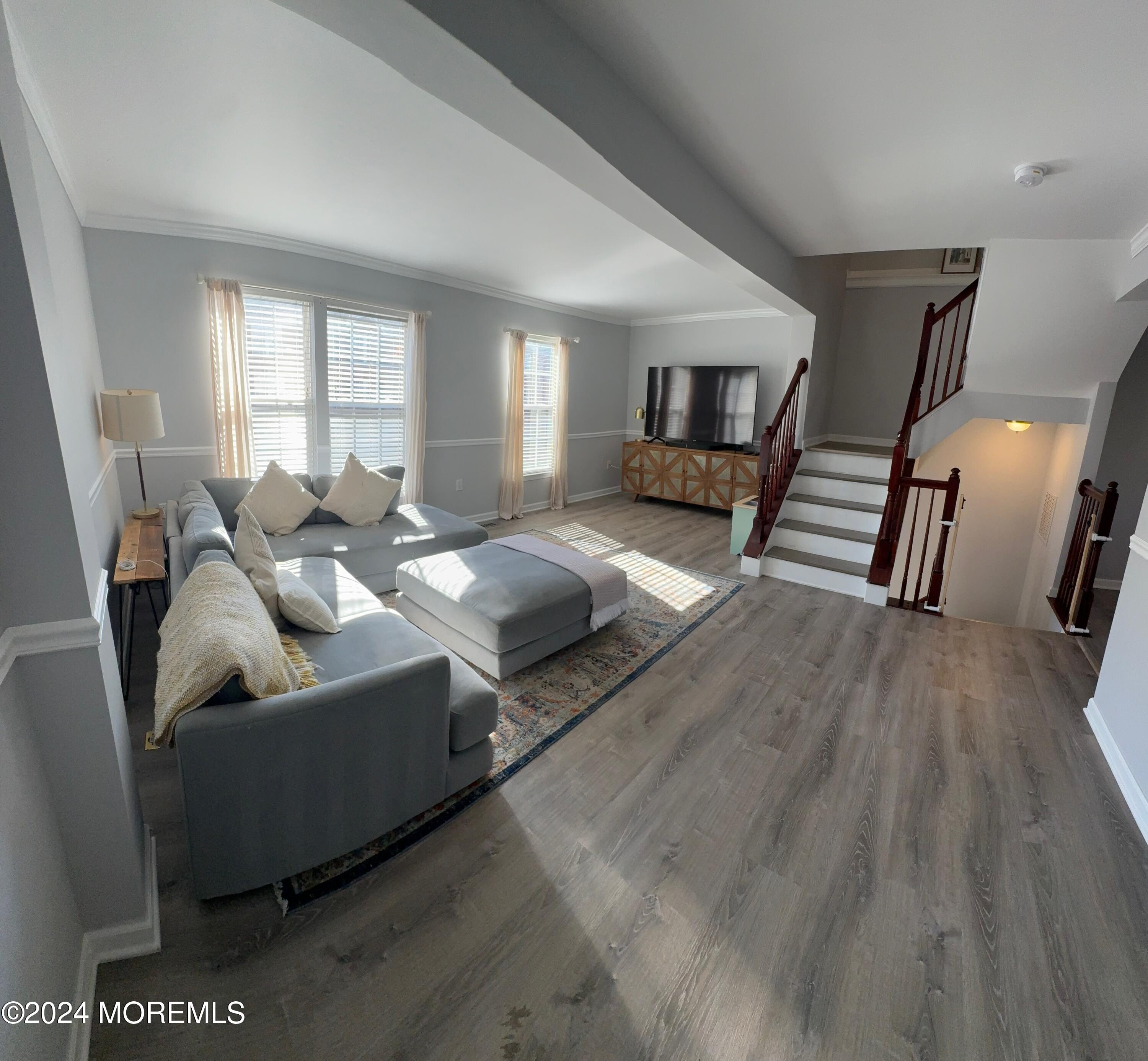 52 Saxton Road Farmingdale, NJ 07727 - Photo 16 of 52 a living room with furniture and a wooden floor