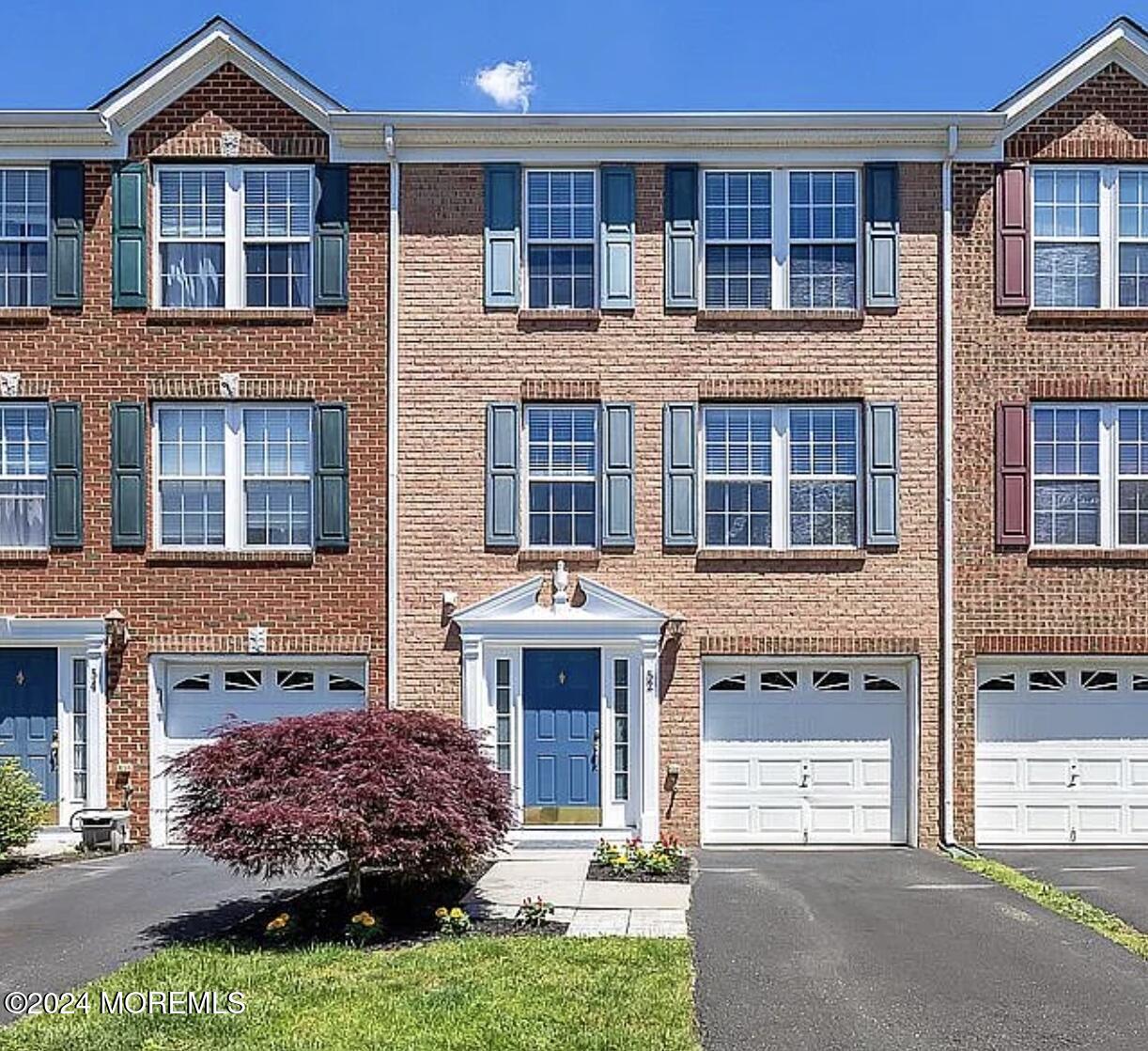 52 Saxton Road Farmingdale, NJ 07727 - Photo 2 of 52 a front view of a house with a yard
