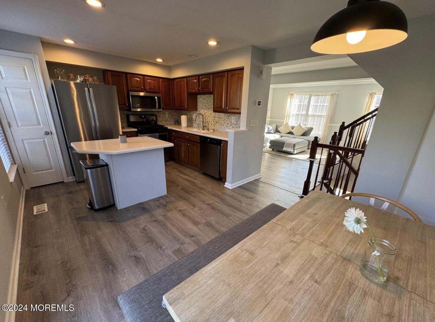 52 Saxton Road Farmingdale, NJ 07727 - Photo 31 of 52 a open kitchen with stainless steel appliances granite countertop a refrigerator oven stove a sink dishwasher and a oven with large countertops