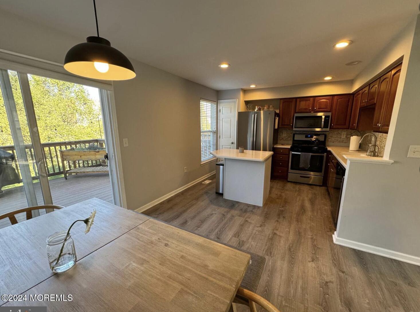 52 Saxton Road Farmingdale, NJ 07727 - Photo 32 of 52 a living room with furniture and a wooden floor
