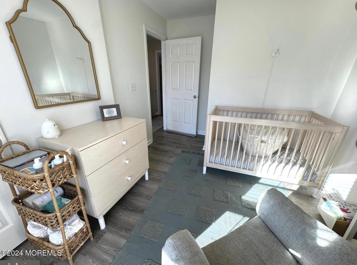 52 Saxton Road Farmingdale, NJ 07727 - Photo 38 of 52 a living room with furniture and a mirror