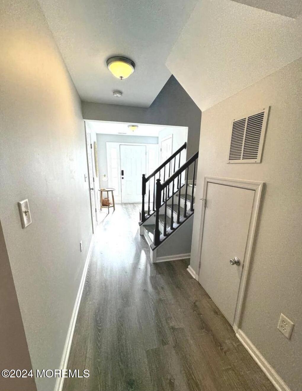 52 Saxton Road Farmingdale, NJ 07727 - Photo 39 of 52 a view of a hallway with wooden floor