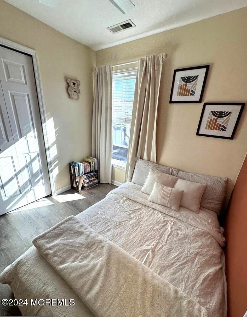 52 Saxton Road Farmingdale, NJ 07727 - Photo 41 of 52 a bedroom with a bed and a window