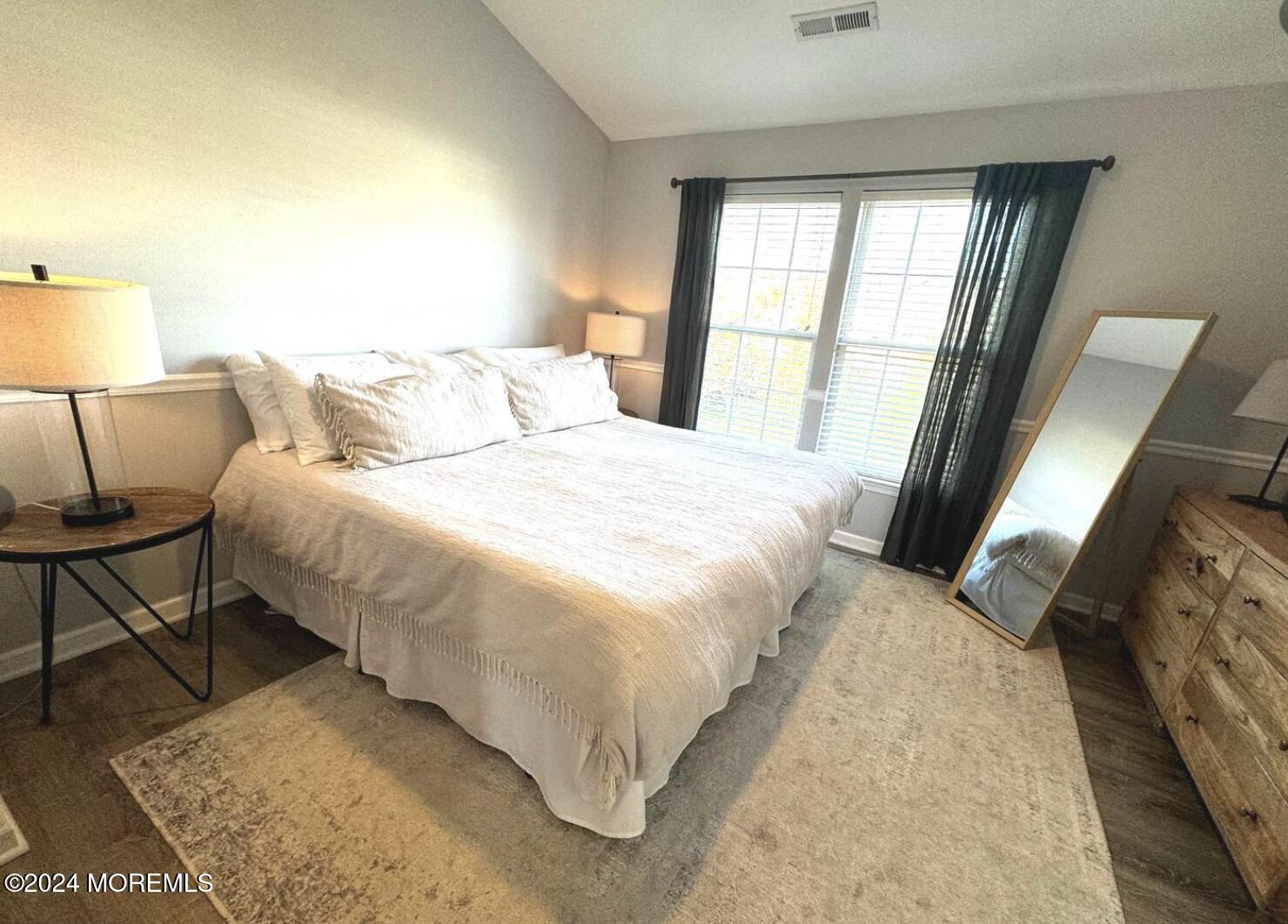 52 Saxton Road Farmingdale, NJ 07727 - Photo 45 of 52 a bedroom with a bed and a lamp next to a window