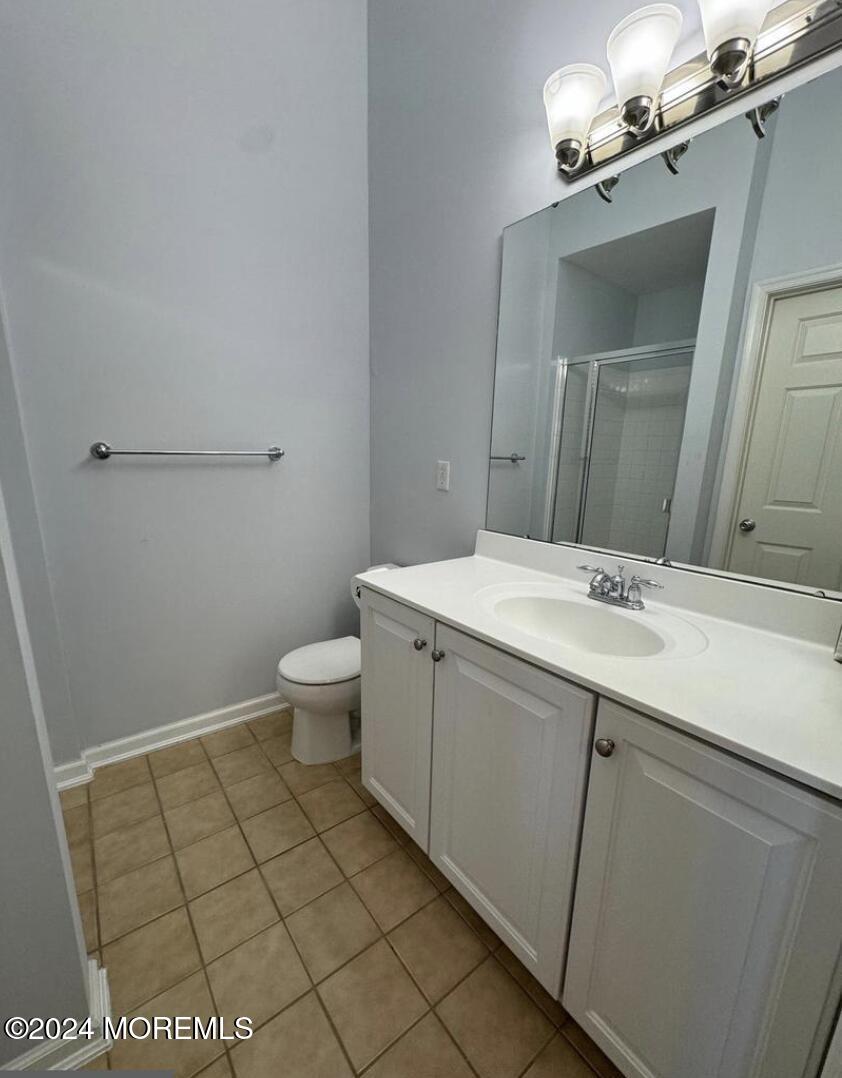 52 Saxton Road Farmingdale, NJ 07727 - Photo 48 of 52 a bathroom with a sink a toilet and mirror