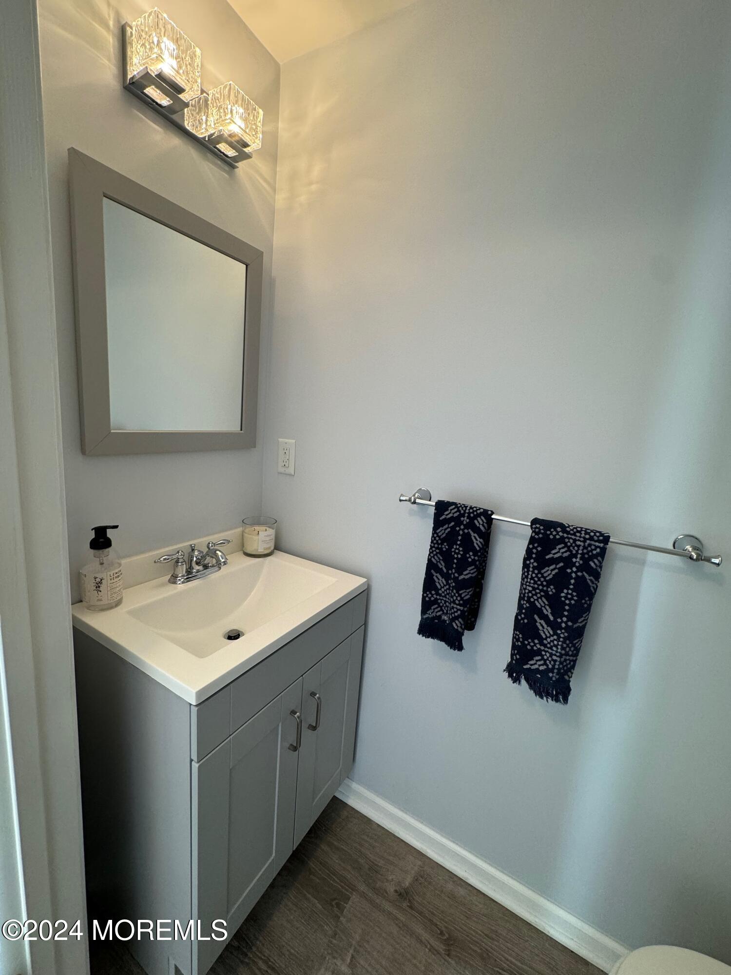 52 Saxton Road Farmingdale, NJ 07727 - Photo 6 of 52 a bathroom with a sink and mirror