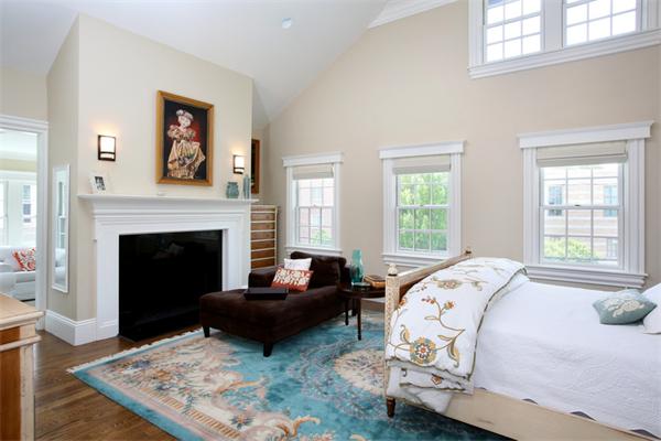59 Green Street, Unit 1 Brookline, MA 02446 - Photo 6 of 7 a living room with furniture large window and a fireplace