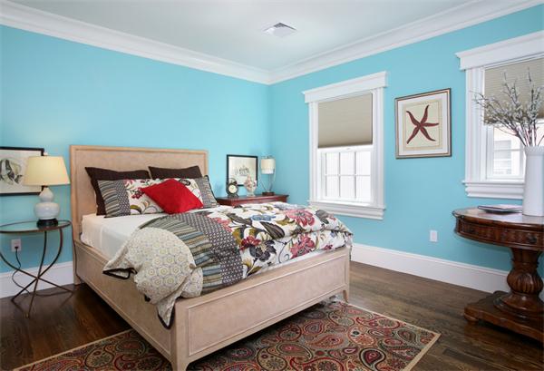 59 Green Street, Unit 1 Brookline, MA 02446 - Photo 7 of 7 a bed sitting in a bedroom next to a window with chair