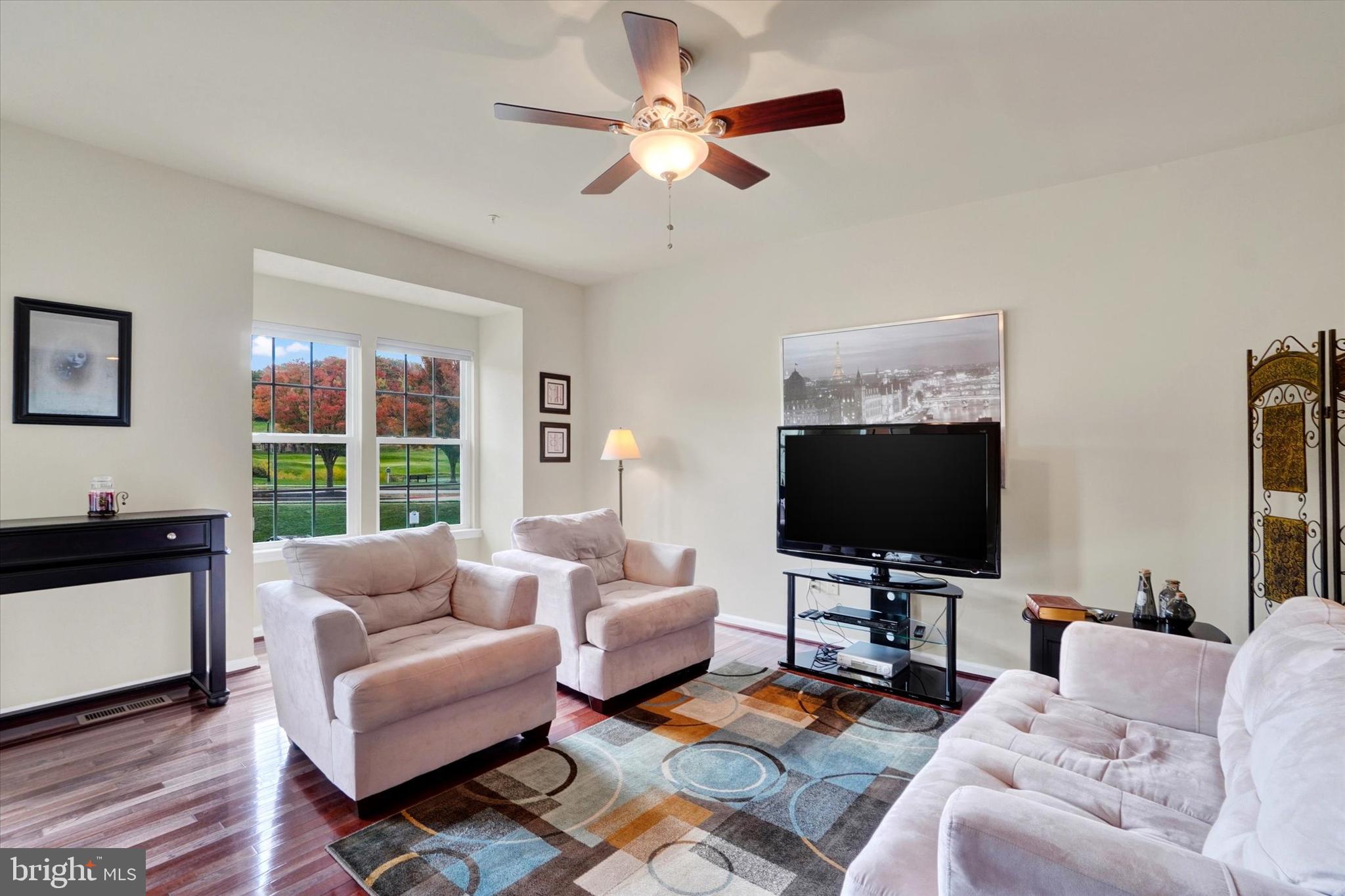 1269 Stonehaven Way, Unit 83 York, PA 17403 - Photo 15 of 28 a living room with furniture and a flat screen tv